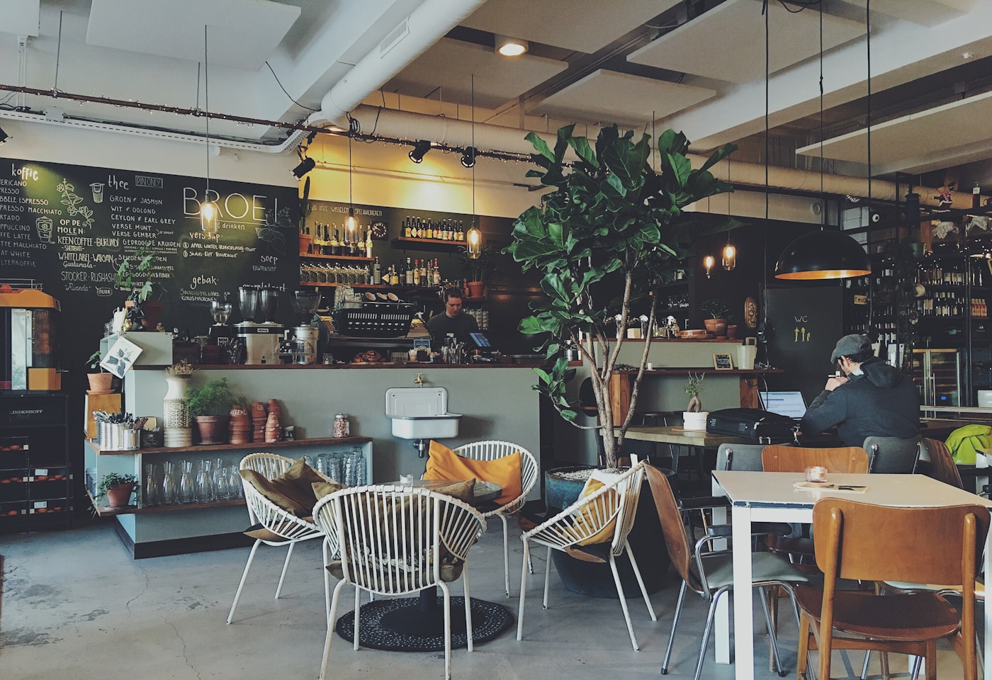 Warm cafe table with fresh brunch dishes and coffee